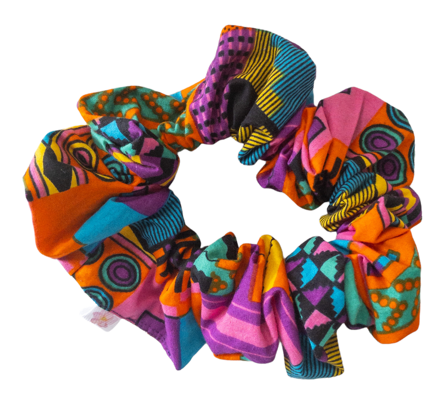 Hair scrunchie with purple and other multi colors such as pink, orange, yellow, blue, and black geometric shape printed kente cloth.