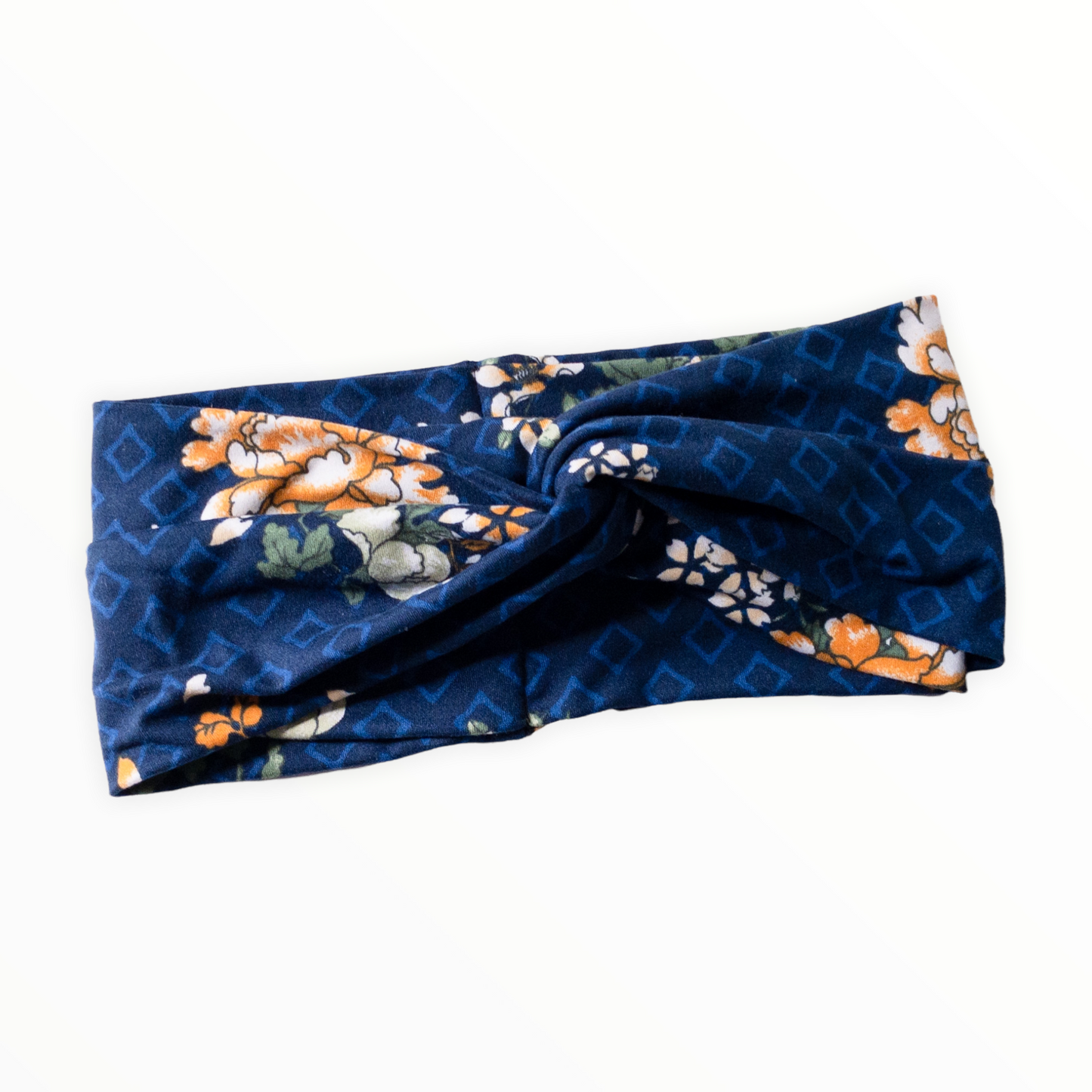 "Navy blue headband, light blue diamond outline shapes on double brushed polyester knit fabric, flowers are combination of golden yellow and white."