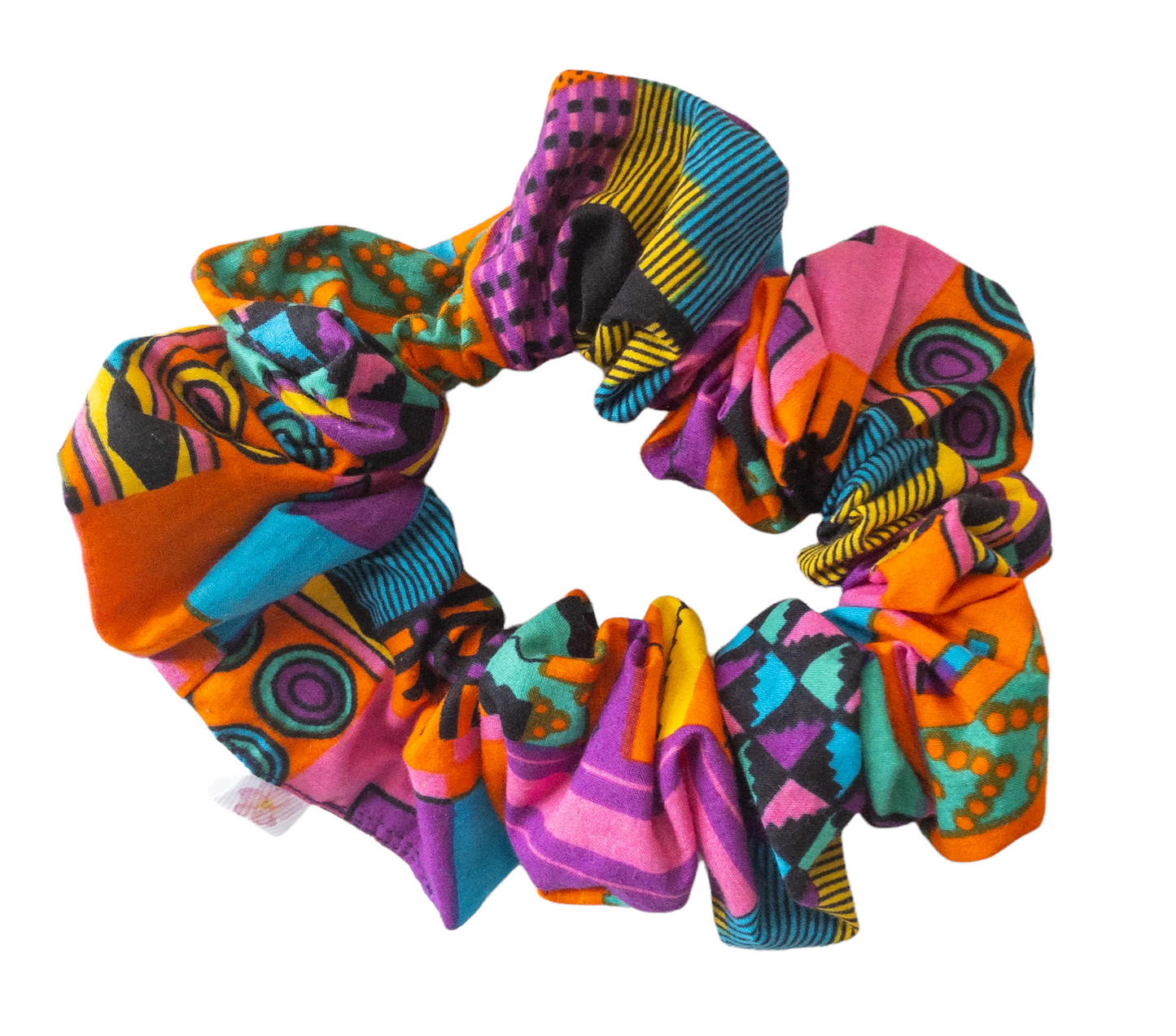 Hair scrunchie with purple and other multi colors such as pink, orange, yellow, blue, and black geometric shape printed kente cloth.