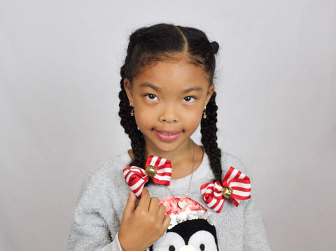 Model wearing Jingle Bell Hair Bows - The Enchanted Magnolia